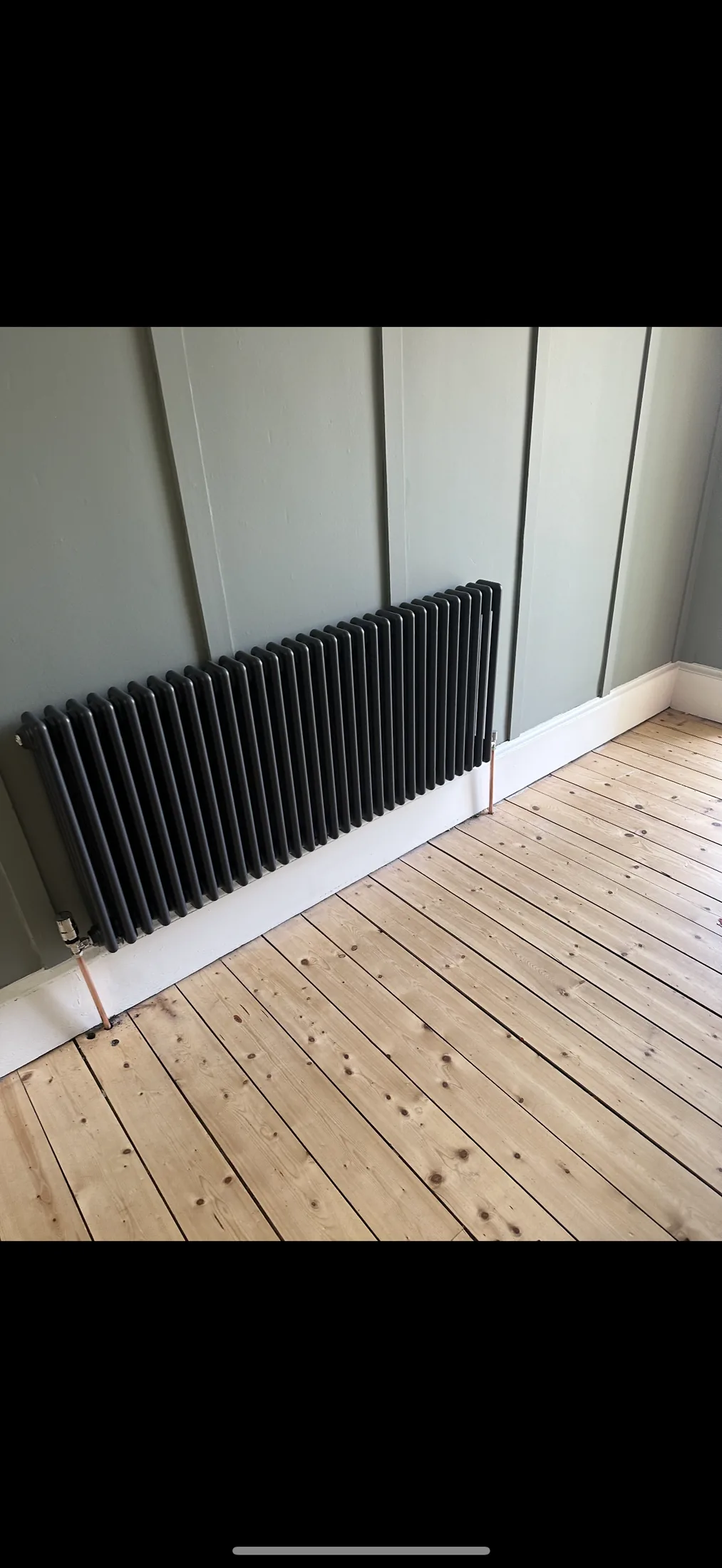 Heated towel radiator fitted in bathroom